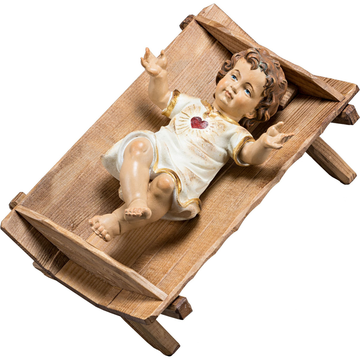 Jesuskind bekleidet mit Herz in einfacher Wiege