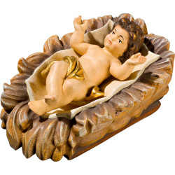Niño Jesús en cuna tallada