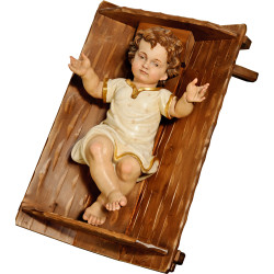 Jesus Child clothed in simple cradle