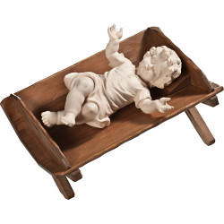 Menino Jesus vestido em cama simples