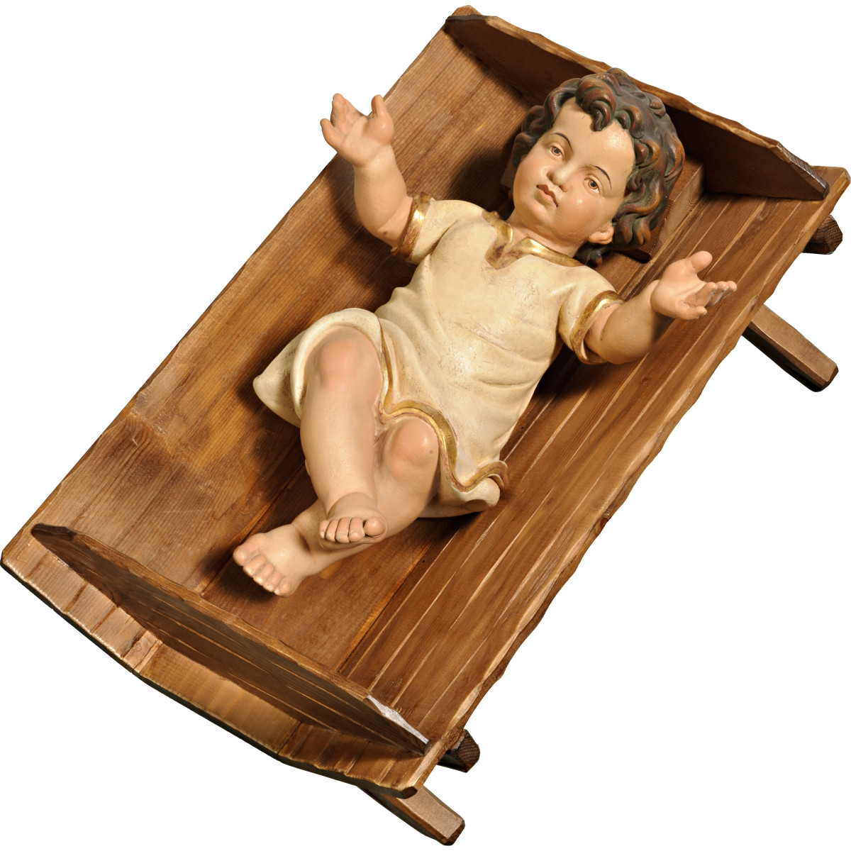 Menino Jesus vestido em cama simples