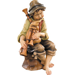 Hirt sitzend mit Dudelsack