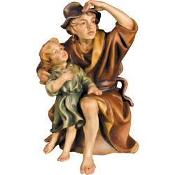 Hirt sitzend mit Junge