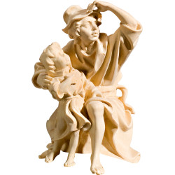 Pastor sentado con niño