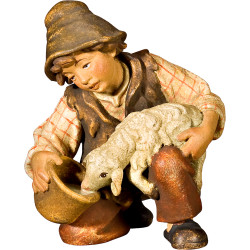 Boy with lamb at the well
