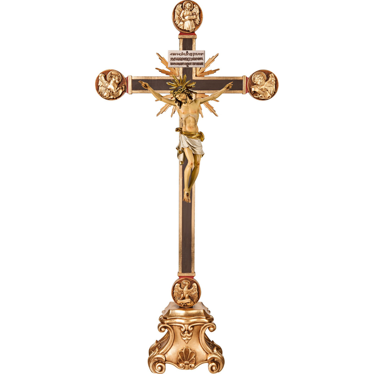Corpus Baroque on cross with Evangelists and rays on pedestal with Titulus Crucis in hebrew - latin - greek