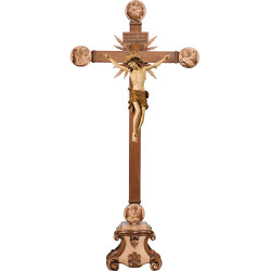 Corpus Pisa on cross with Evangelists and rays on pedestal with Titulus Crucis in hebrew - latin - greek