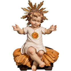 Jesus Child clothed with Heart sitting in cradle