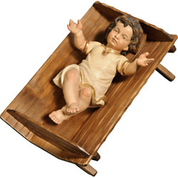 Jesus Child clothed in simple cradle