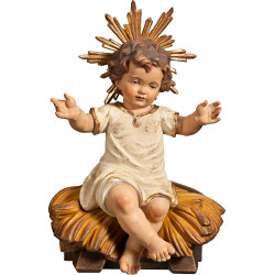 Jesus Child clothed sitting with cradle