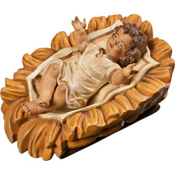 Jesus Child clothed in carved cradle
