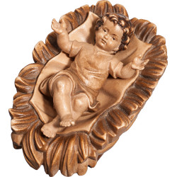 Jesus Child clothed in carved cradle